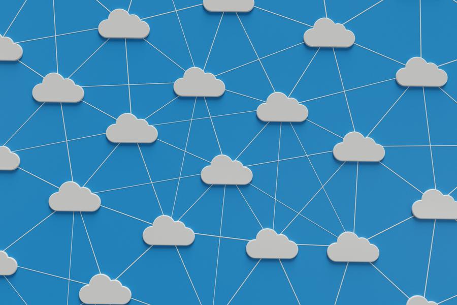 A mesh of cloud symbols joined by connecting lines on a blue background.